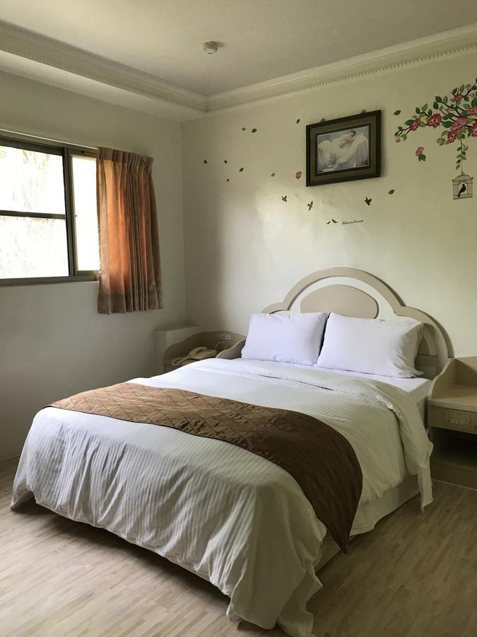 Minren Hotel Yuchi Bagian luar foto